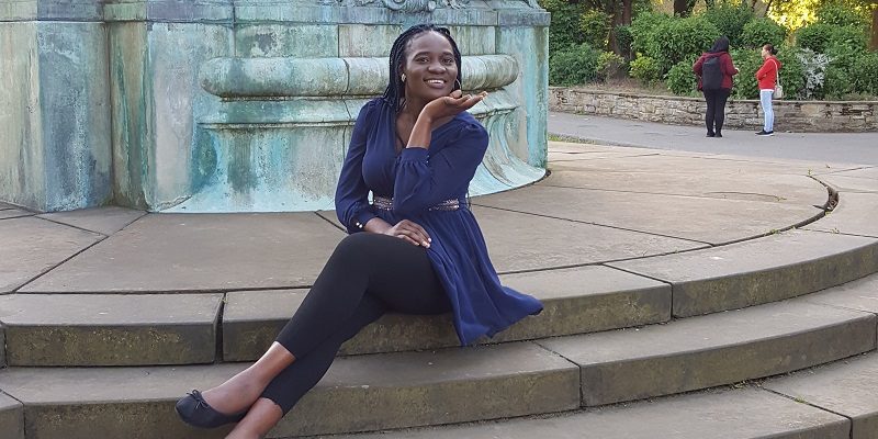 Student Ejiro sitting on steps