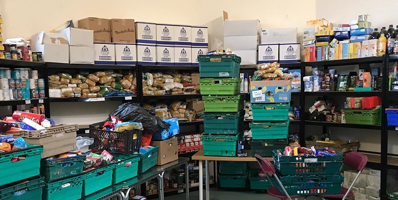 a store room full of food and green crates