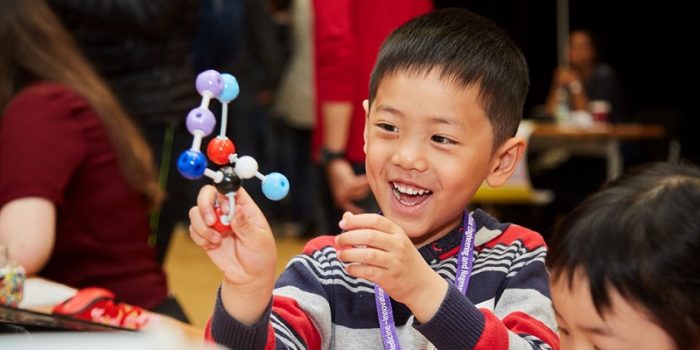 Child creating a molecule structure