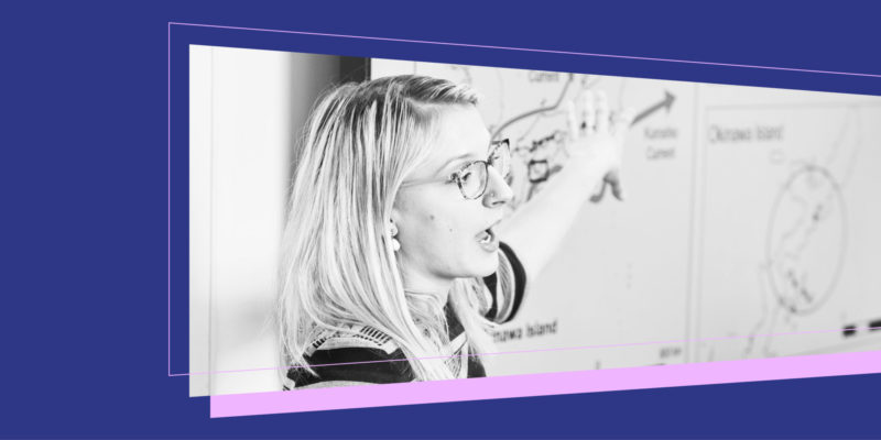 Graphic with a black and white photograph of a woman presenting from a screen.