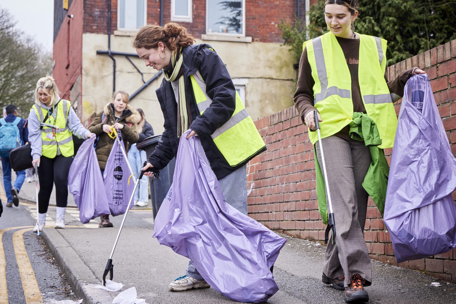 A group of people participating in a litter pick.