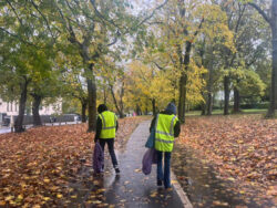 Two people doing a litter pick in Hyde Park