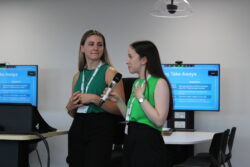 Emma Green talking into a microphone in a seminar room setting